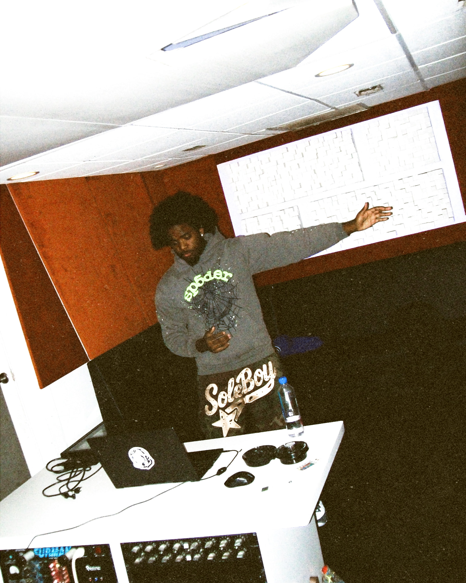 LMG Stevee in the studio behind the boards